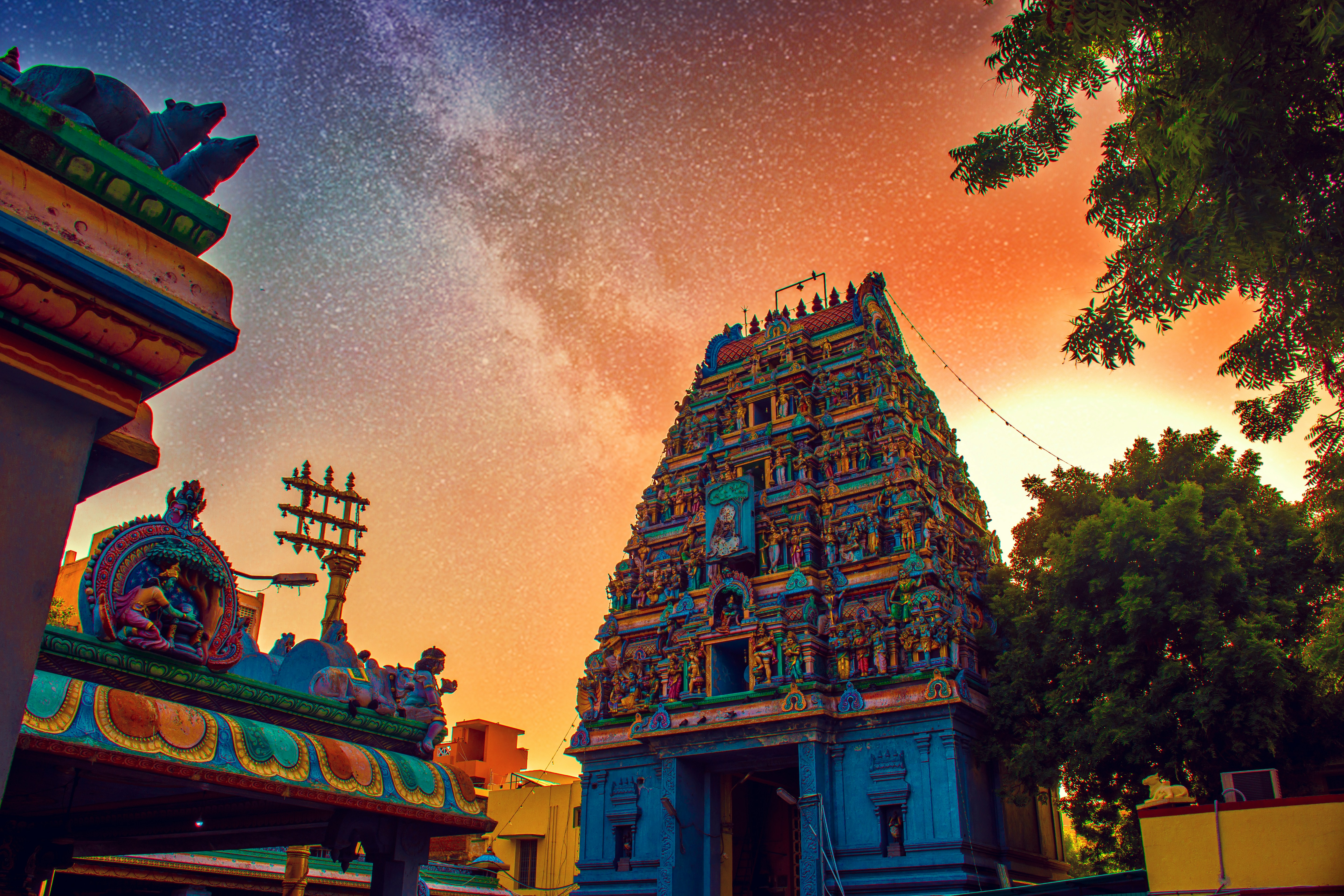 Temple tour car parked outside a South Indian temple gopuram